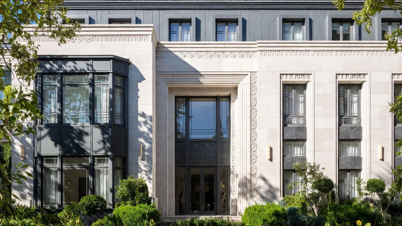 Contemporary luxury residential tower with Art Deco-inspired geometric facade and materials